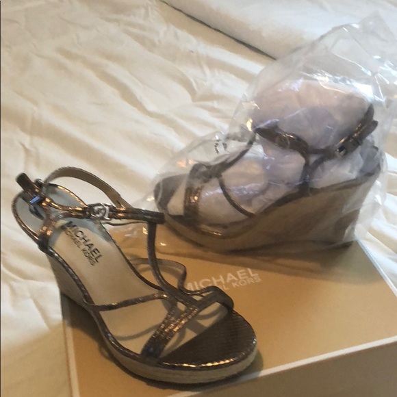 Michael Kors Shoes - Pair of Michael Kors cicely wedge size 8